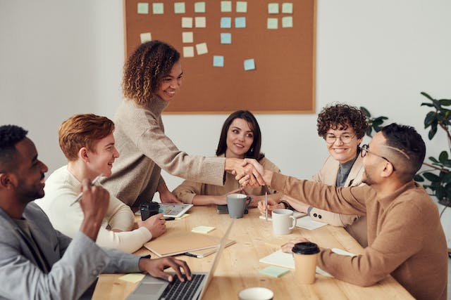 group-of-business-professionals-in-a-meeting-shaking-hands