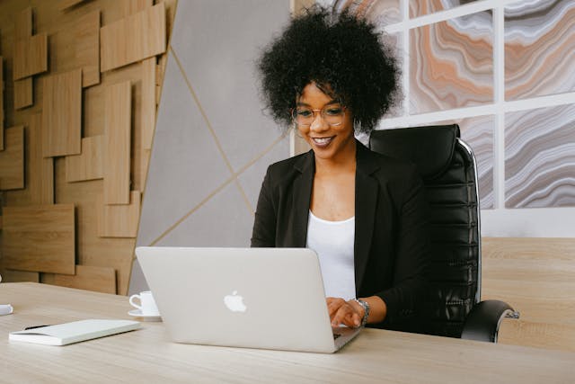 a-business-person-working-on-their-computer-at-their-desk