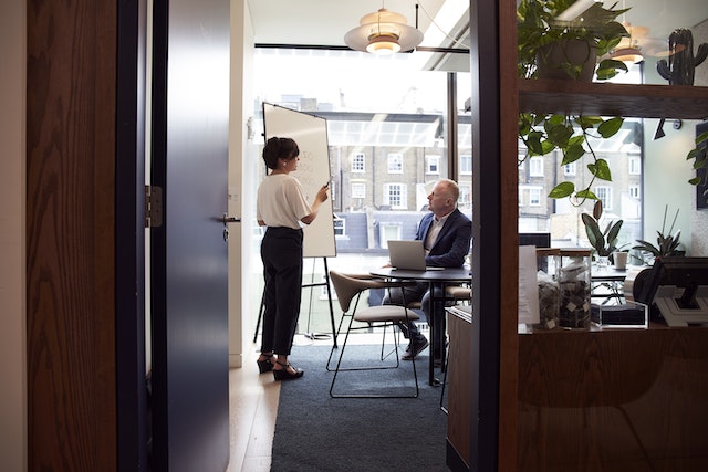 two people in a boardroom