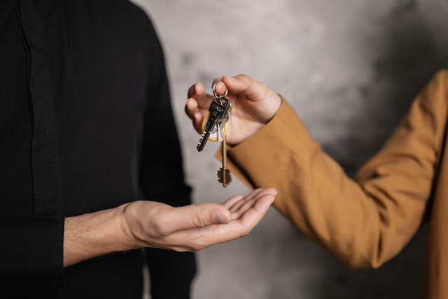 property-manager-handing-over-house-keys-to-new-tenant