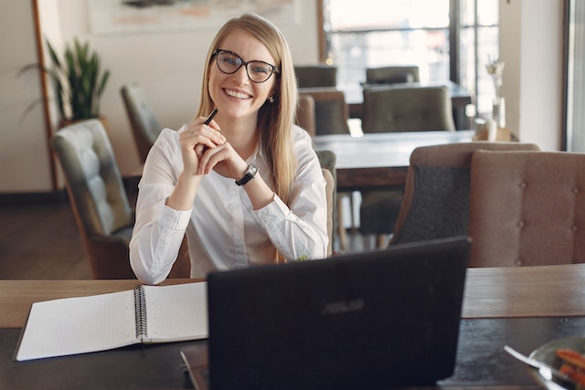 property manager sitting at their desk smiling