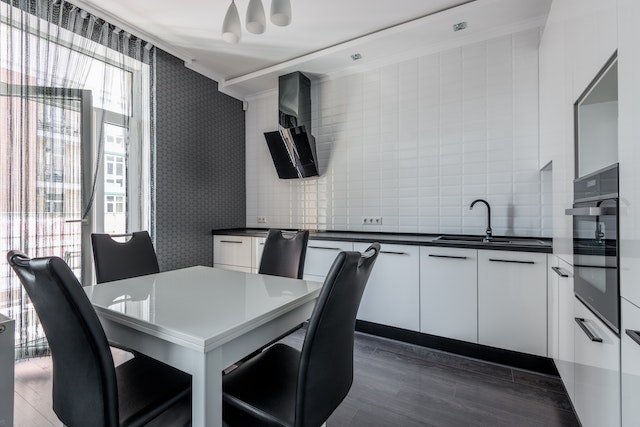 white kitchen with black hardware and counts