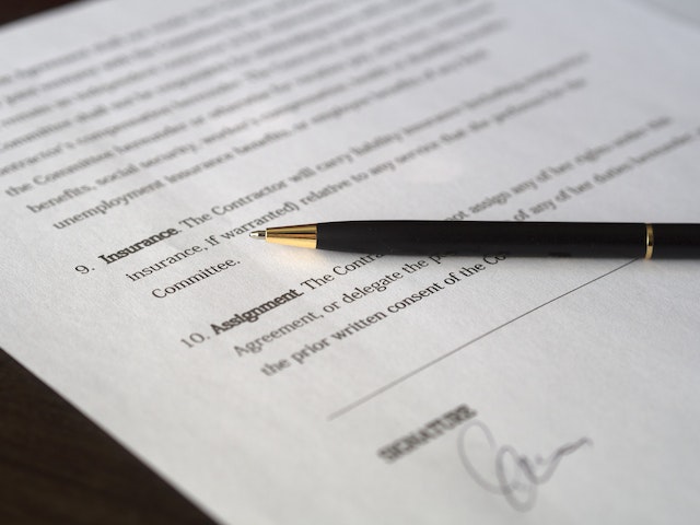 lease agreement with a pen on top of it