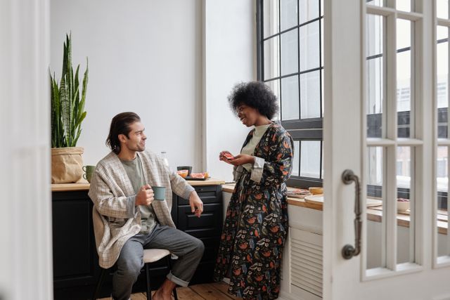 two people chatting in a room