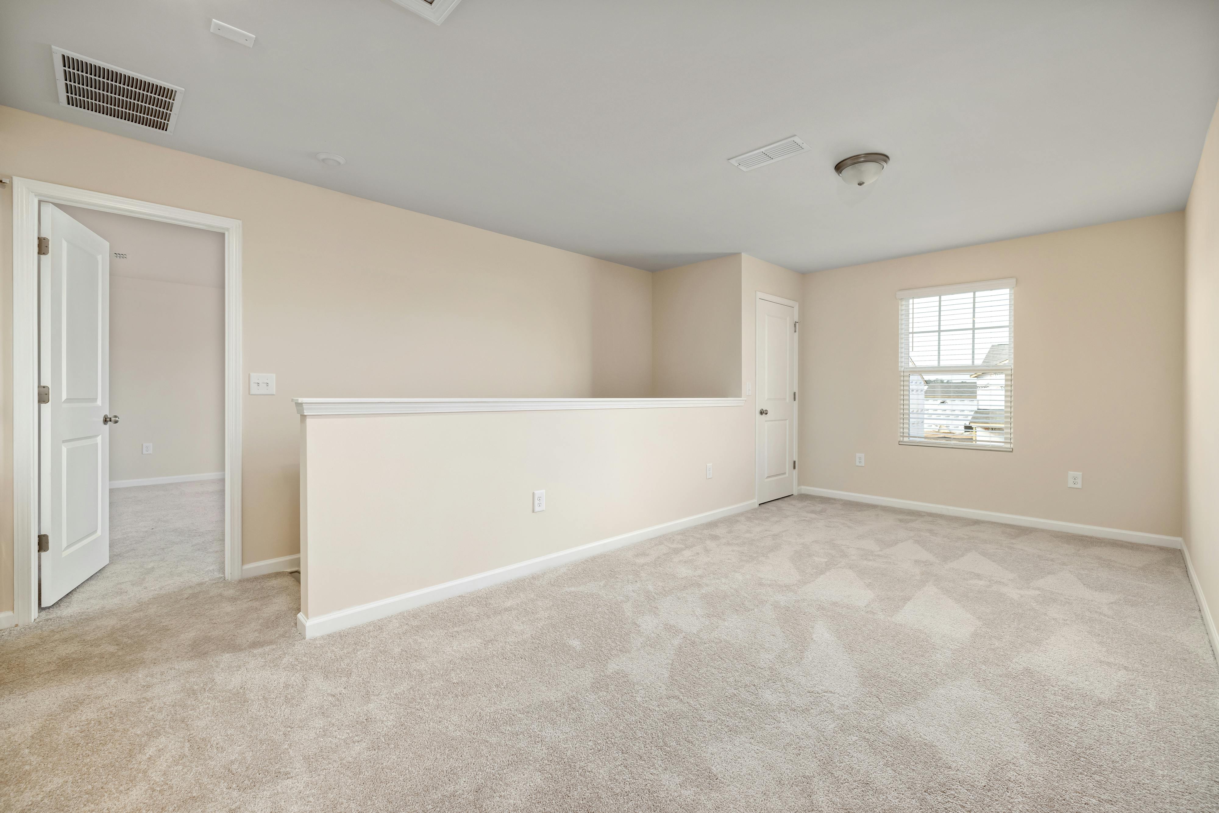 Empty White Room with Gray Carpet in Tewksbury
