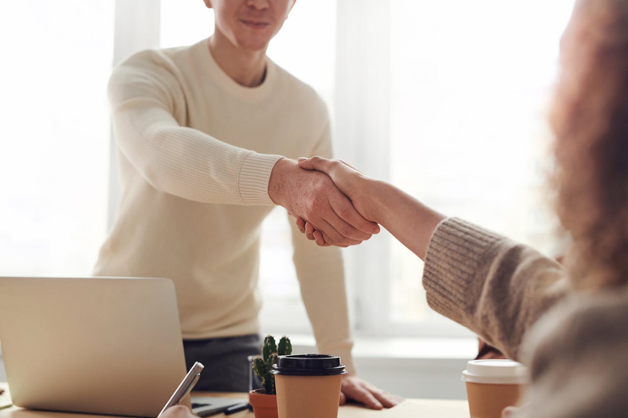 an owner shaking hands with a tenant